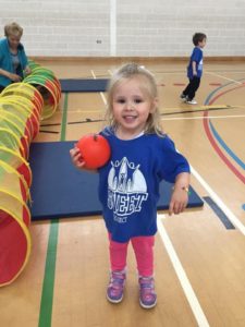 little girl playing in a gym